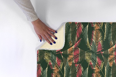 Alfombra infantil Hojas de palmera de colores sobre fondo oscuro