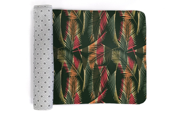Alfombra infantil Hojas de palmera de colores sobre fondo oscuro